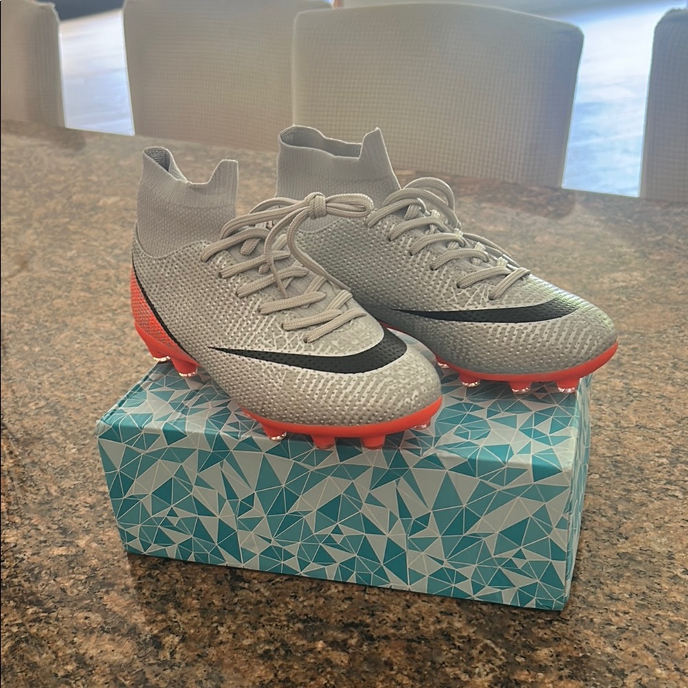 Gray and Orange Soccer Cleats